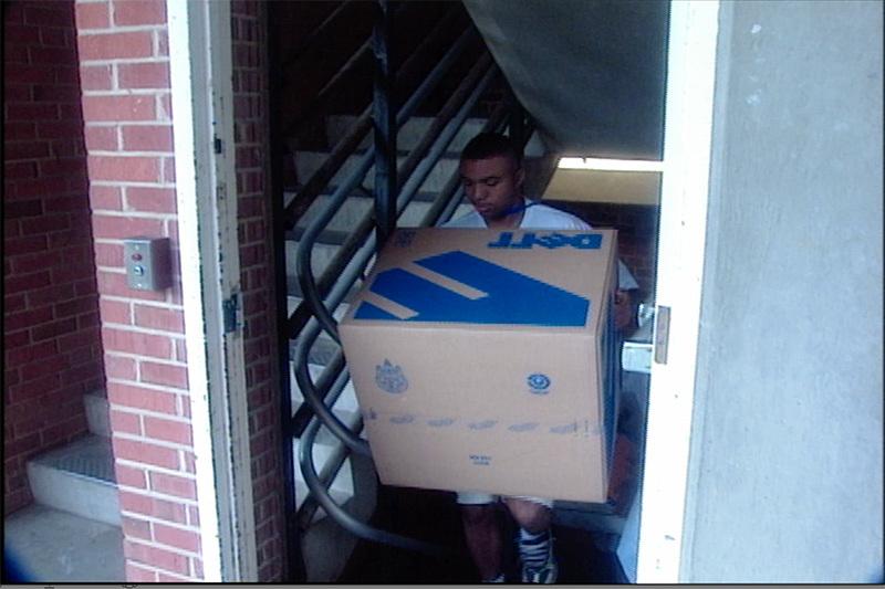 A student using her 1990s-era laptop on the campus of UNC-Chapel Hill.