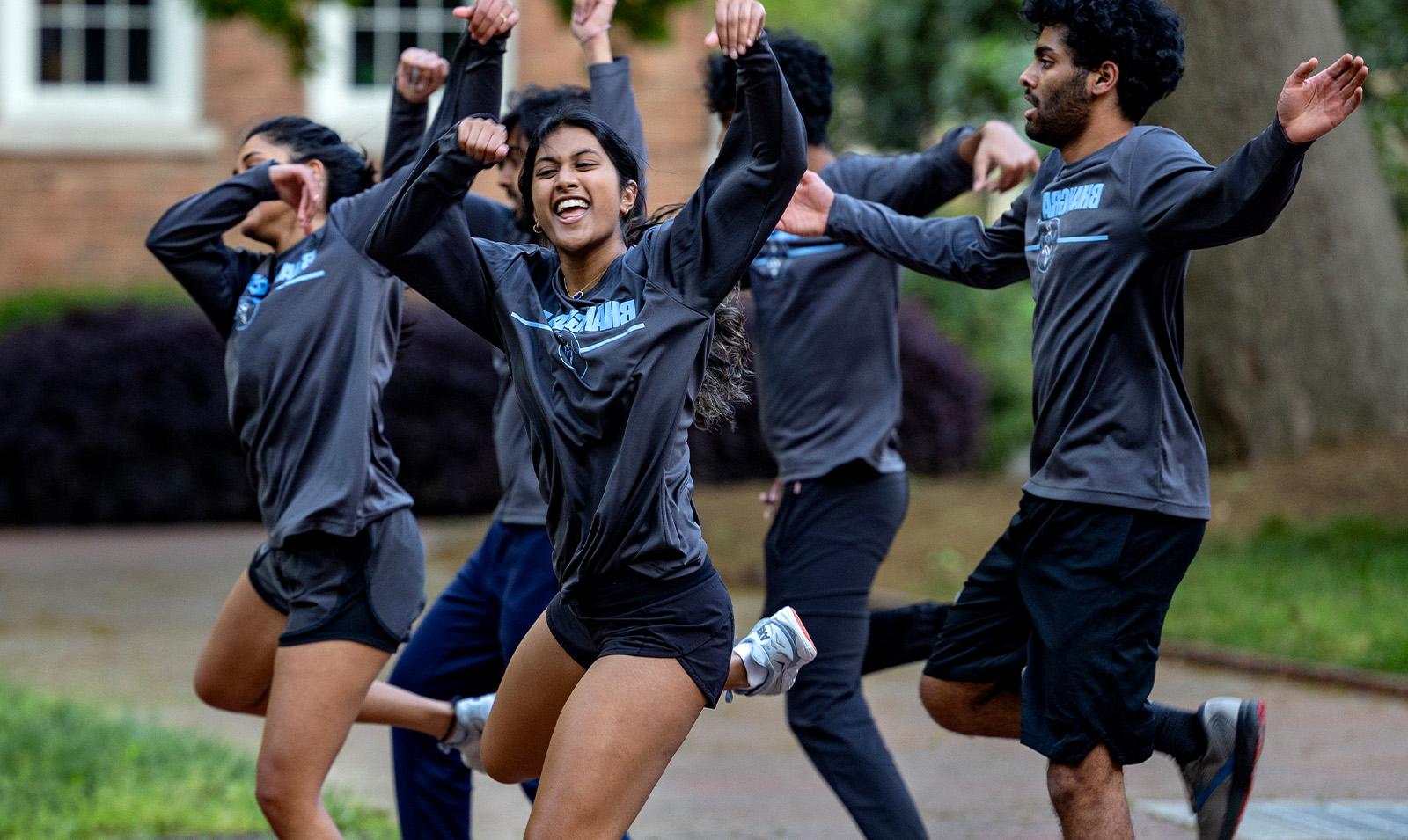 A group of students doing a coordinated dance routine.